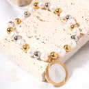Catholic Town Bracelet, stainless steel Virgen de la Caridad del Cobre medal, natural pearl and stainless steel beads.